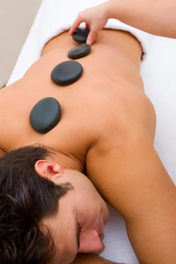 man having hot stone massage spa saloon 42705850